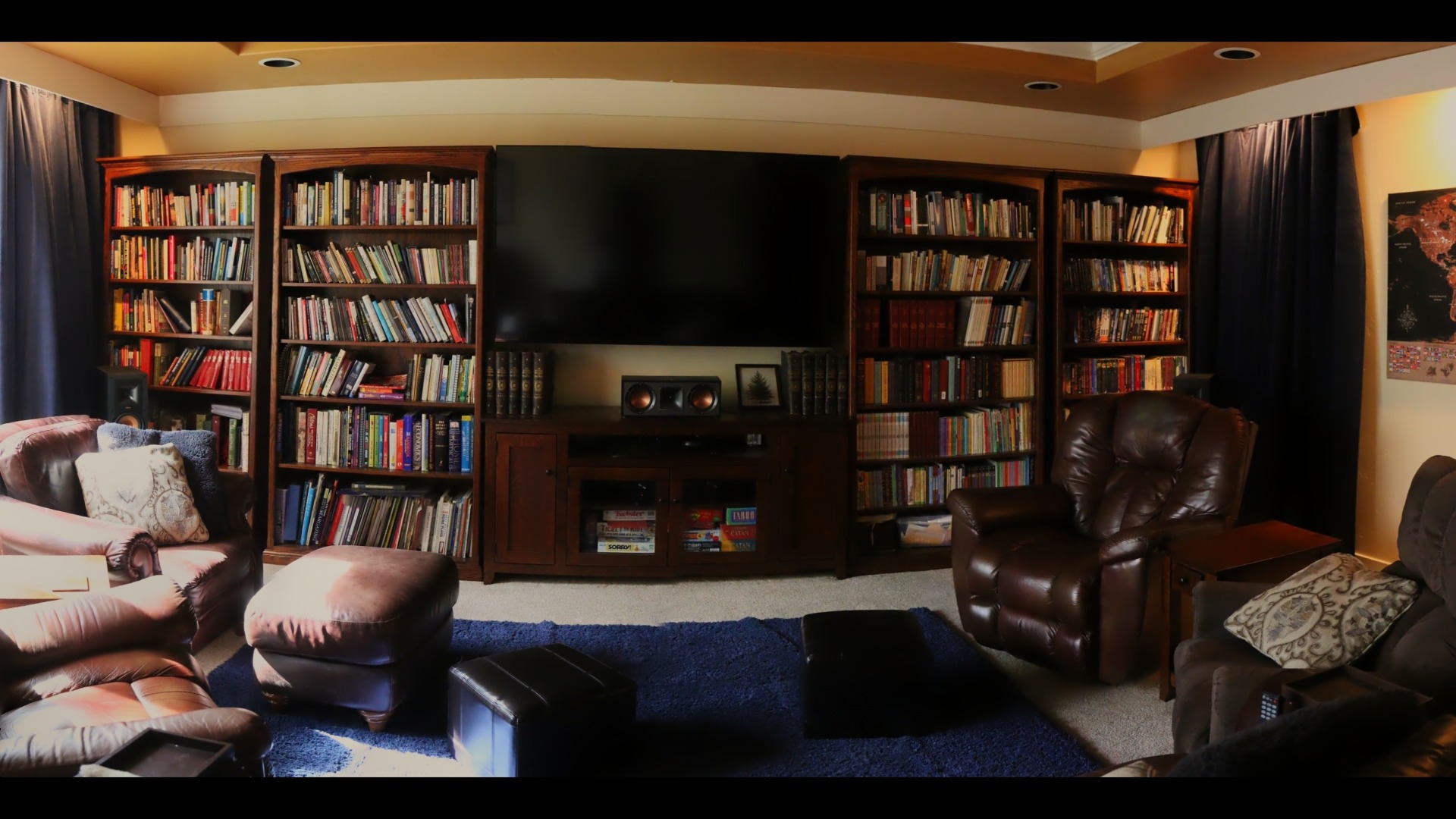 Low-light side lighting and bookshelves in the finished media room