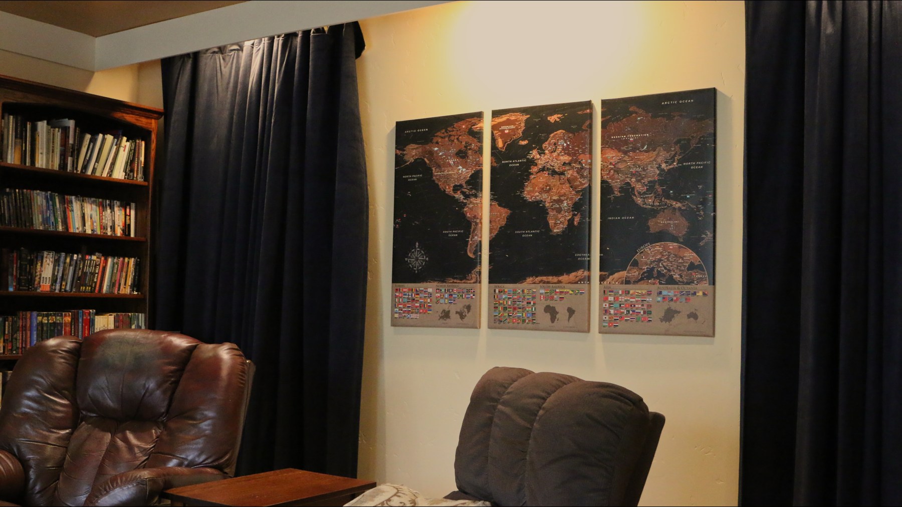 Curtains and custom wall imagery in the finished media room